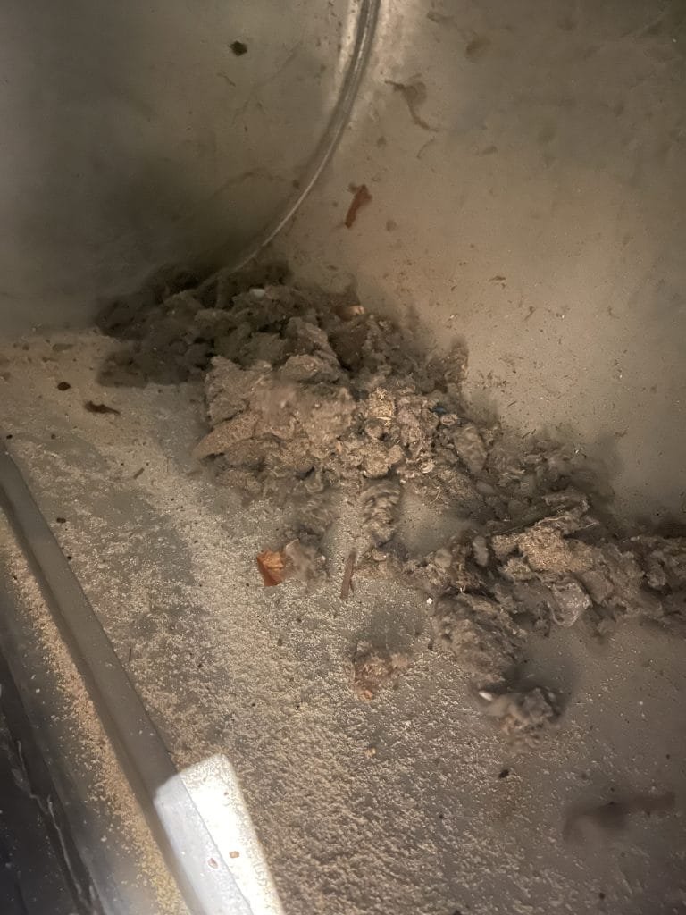 Loose dust pulled from an air return drop