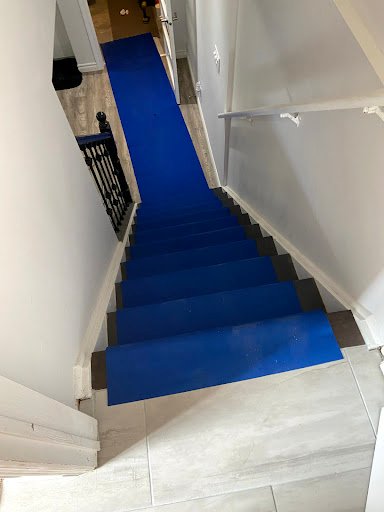 Floor and staircase protection during a duct cleaning job, photo shared by client Kevin Wong